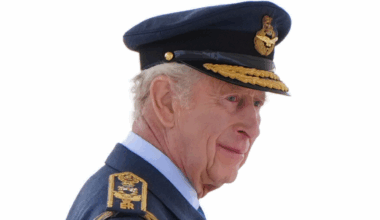 King Charles wearing a blue military uniform
