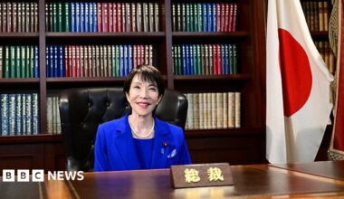 Sanae Takaichi poses for a photo in the party leader's office after the LDP presidential election.