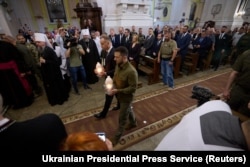 Ukrainian President Volodymyr Zelenskyy (right) and then-Polish President Andrzej Duda commemorate victims of the Volhynia killings in Lutsk, Ukraine, in July 2023.