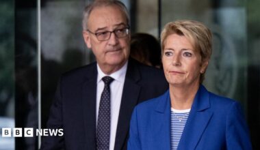 A gloomy looking Karin Keller-Sutter, with economy minister Guy Parmelin, leave the US Department of State after talks in August.