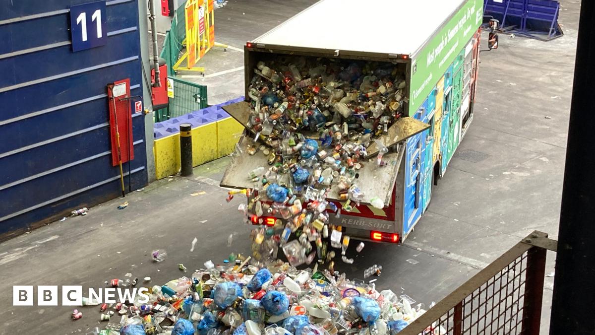 Recycling van with back door open. There is tonnes of rubbish pouring out of the back of van