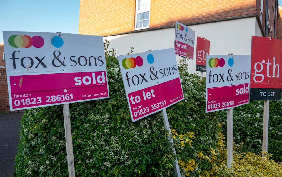 TAUNTON, UNITED KINGDOM - MAY 11:  Estate agent for sale and for rent boards are displayed outside properties that are for sale, on May 11, 2025 in Taunton, England. Although the average house price remained below the all time high set in 2022 and despite affordability issues for many buyers, the housing market in the UK has remained surprisingly resilient. (Photo by Anna Barclay/Getty Images)
