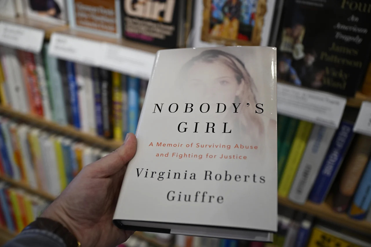 BURLINGAME, CALIFORNIA - OCTOBER 21: A view of Virginia Roberts Giuffre's new book 'Nobody's Girl'' at the Barnes and Noble bookstore in Burlingame, California, United States on October 21, 2025. Virginia Giuffre offers clues about Jeffrey Epstein's political clients in Posthumous Memoir: All the unnamed politicians she describes. (Photo by Tayfun Cokun/Anadolu via Getty Images)