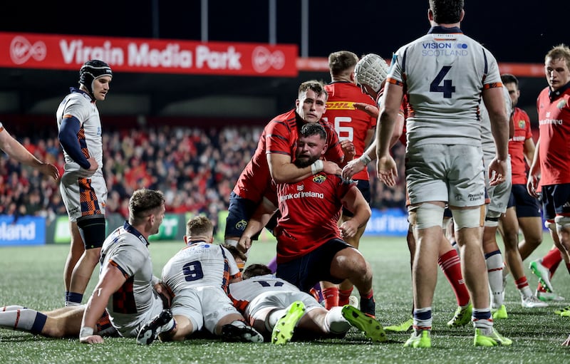 Munster's Michael Milne celebrates scoring a try with Brian Gleeson. Photograph: Dan Sheridan/Inpho