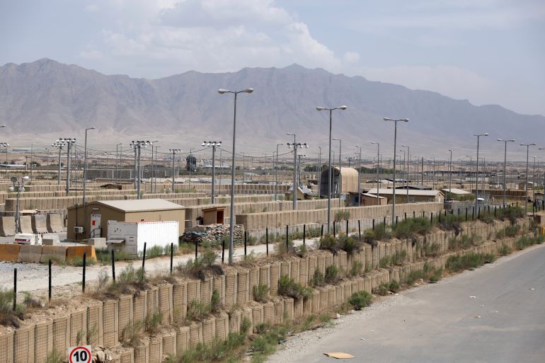 Blast wallls and a few buildings can be seen at the Bagram air base after the American military left the base, in Parwan province north of Kabul, Afghanistan, Monday, July 5, 2021. The U.S. left Afghanistan's Bagram Airfield after nearly 20 years, winding up its "forever war," in the night, without notifying the new Afghan commander until more than two hours after they slipped away. [Rahmat Gul/AP]