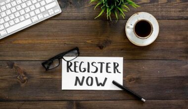 Register Now sign on a desk