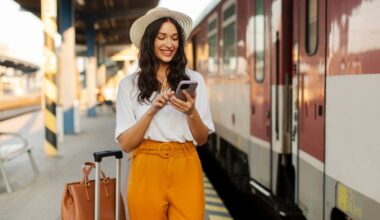 Woman with luggage boarding train in Europe