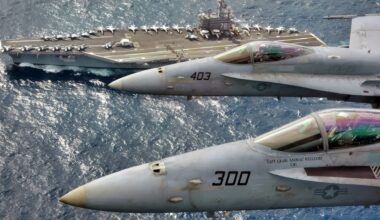 At sea (Mar. 1, 2007) – Capt. Craig “Animal” Williams (front) in a F/A 18C Hornet (front) and Capt. Richard “Rhett” Butler (back) in an F/A 18C Hornet look up for a photo as they fly over USS Ronald Reagan (CVN 76). Capt. Williams, a 22-year Naval Aviator who graduated from the United States Naval Academy, was relieved as Commander, Carrier Air Wing Fourteen (CVW-14) by 21-year Naval Aviator, Capt. Butler, a graduate of the University of Kentucky during an aerial change of command ceremony. The Ronald Reagan Carrier Strike Group is currently underway in the Pacific Ocean on a surge deployment in support of U.S. military operations in the Western Pacific. Official U.S. Navy photo by Lt. Cmdr. Tam Pham