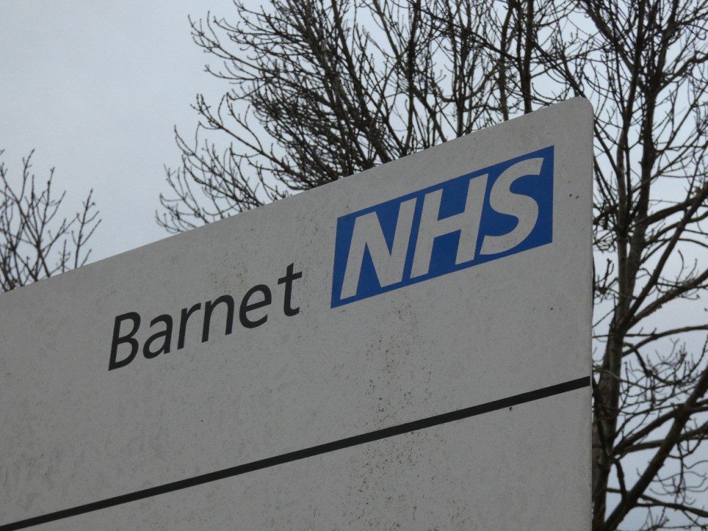 A sign with the 'Barnet NHS' logo in the top corner