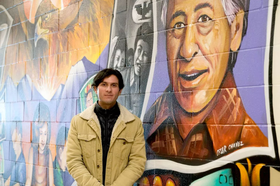 Eduardo Chavez stands next to a mural of his grandfather, labor leader Cesar Chavez. (Monica Carrillo-Casas/The Spokesman-Review)