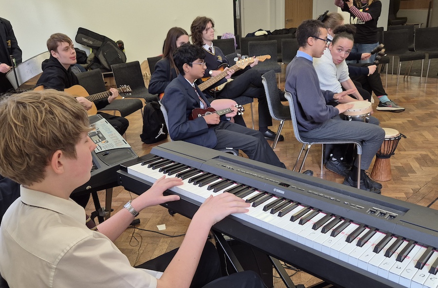 Create charity rehearsal. Someone playing the keyboard.