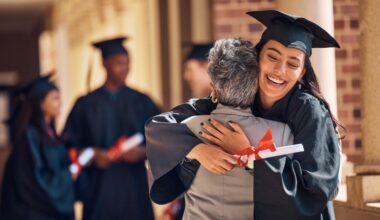 graduating girl looking happy hugging another woman