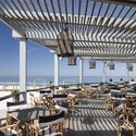 Sétimo Ano de Praia Beach Support Facility / Lousinha Arquitectos - Exterior Photography, Wood, Chair, Table, Deck, Coast