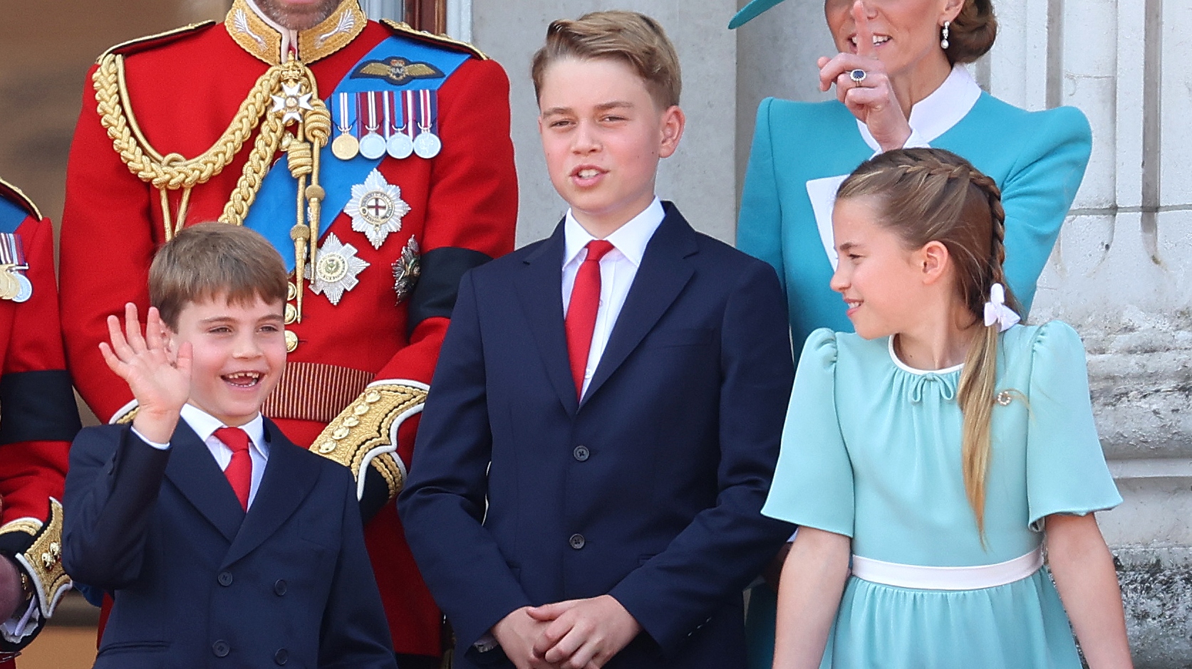 Prince Louis, Prince George and Princess Charlotte stand on the balcony of Buckingham Palace at Trooping the Colour
