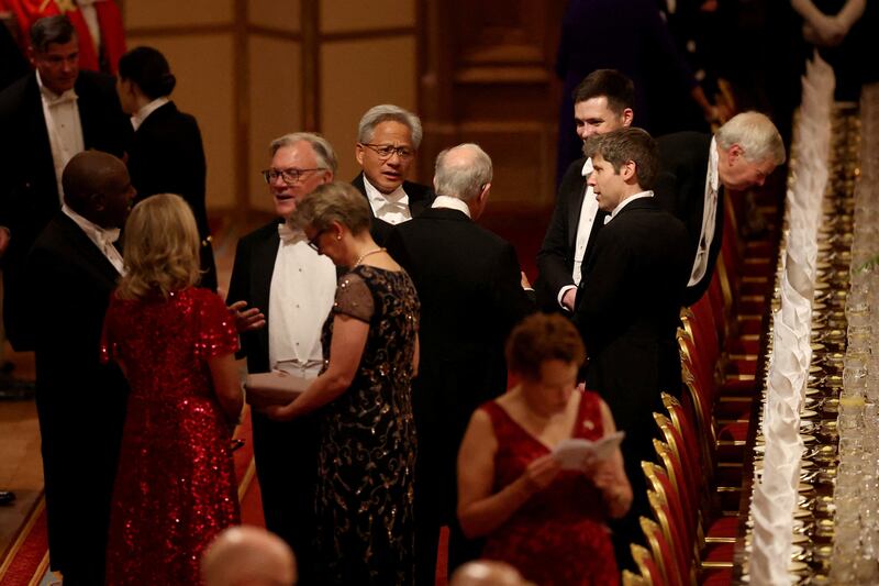 OpenAI chief executive Sam Altman (right) and Nvidia chief executive Jensen Huang (centre)  at the state banquet. Photograph: Phil Noble/PA Wire 


