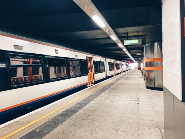 Commuter train in covered station platform