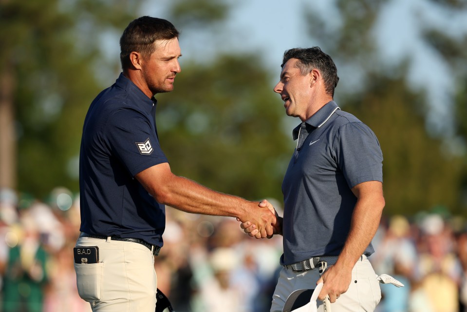 Bryson DeChambeau shakes hands with Rory McIlroy