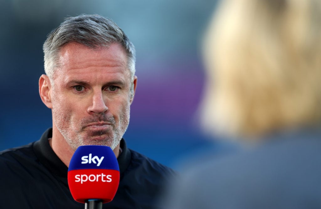 Jamie Carragher looks on before a match as a Sky Sports pundit