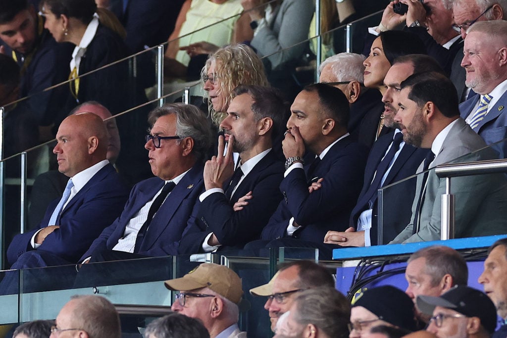 Leeds United's Paraag Marathe with Adam Underwood, Robbie Evans, and more in directors box