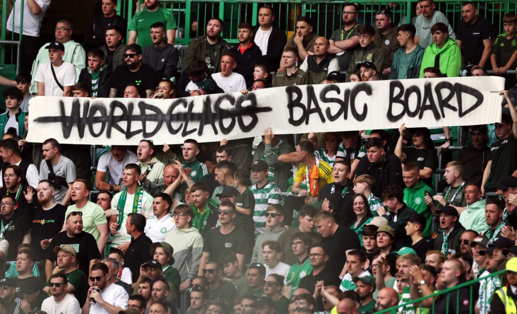 Celtic fans display a banner during the Premier League match between Celtic and Livingston at Celtic Park