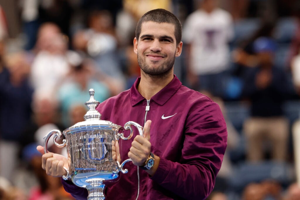 Carlos Alcaraz of Spain during the podium ceremony after defeating Jannik Sinner of Italy in the Men's Singles Final match on day fifteen of the 2025 US Open Tennis Championships at USTA Billie Jean King National Tennis Center.