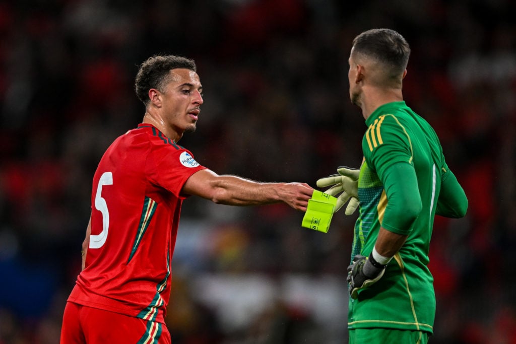 Ethan Ampadu hands the captain's armband to Karl Darlow during England v Wales - International Friendly