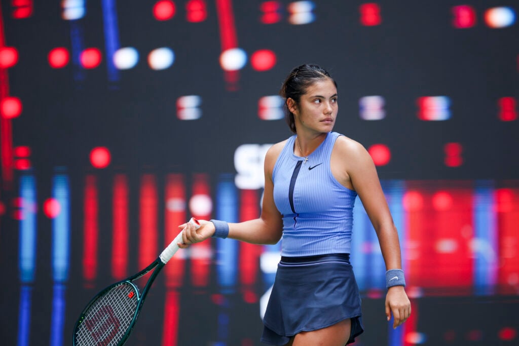Emma Raducanu of Great Britain reacts in the Women's Singles Round of 64 match against Ann Li of United States on day 4 of 2025 Wuhan Open at Optics Valley International Tennis Center.