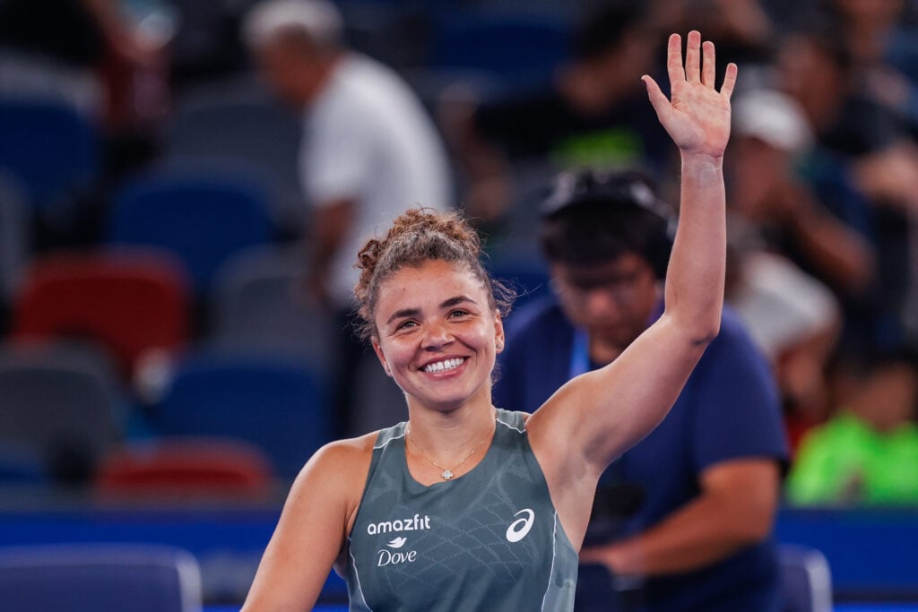 Jasmine Paolini celebrates winning against Iga Swiatek at the Wuhan Open