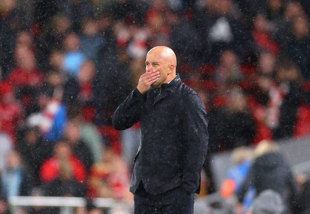 Arne Slot looks on in the rain during Liverpool's Carabao Cup defeat to Crystal Palace.