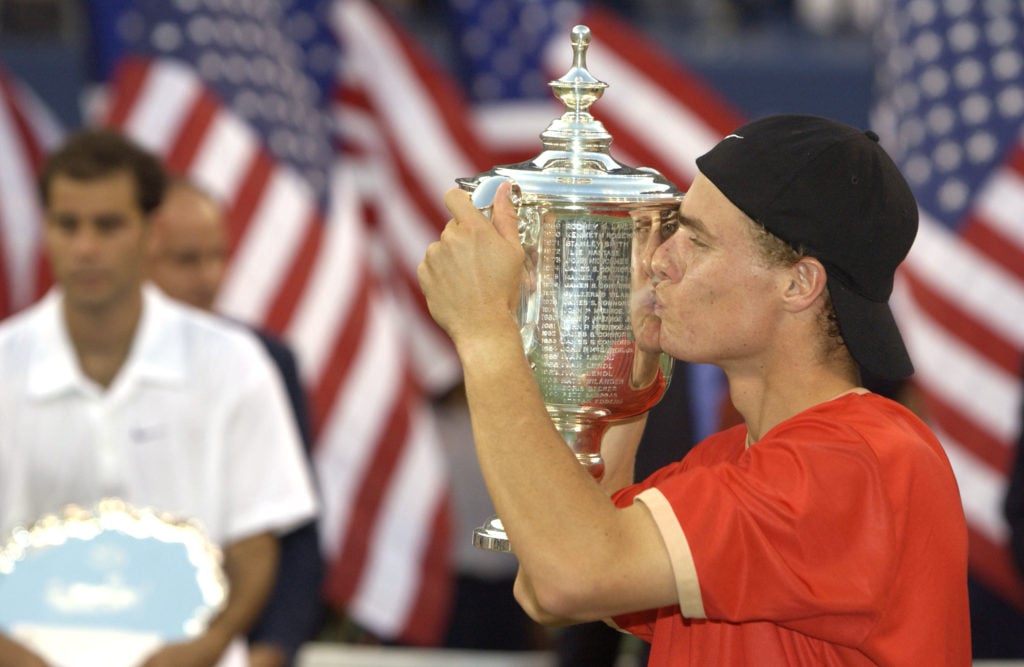 Lleyton Hewitt kisses the US Open trophy after beating Pete Sampras in the final