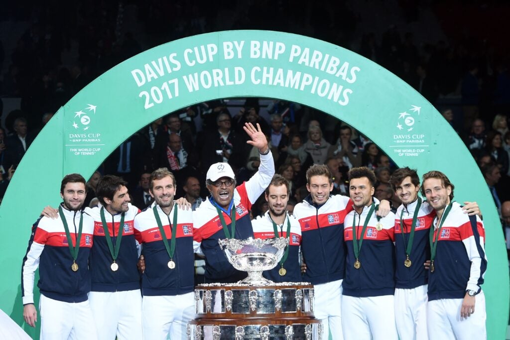 Gilles Simon, Jeremy Chardy, Julien Benneteau, Yannick Noah, Richard Gasquet, Nicolas Mahut, Jo-Wilfried Tsonga Pierre-Hugues Herbert and Lucas Pouille pose with the trophy after winning the Davis Cup World Group final tennis match between France and Belgium at The Pierre Mauroy Stadium in Villeneuve d'Ascq near Lille.