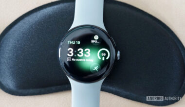 A Google Pixel Watch 3 displays the watch face Tidal Glow.