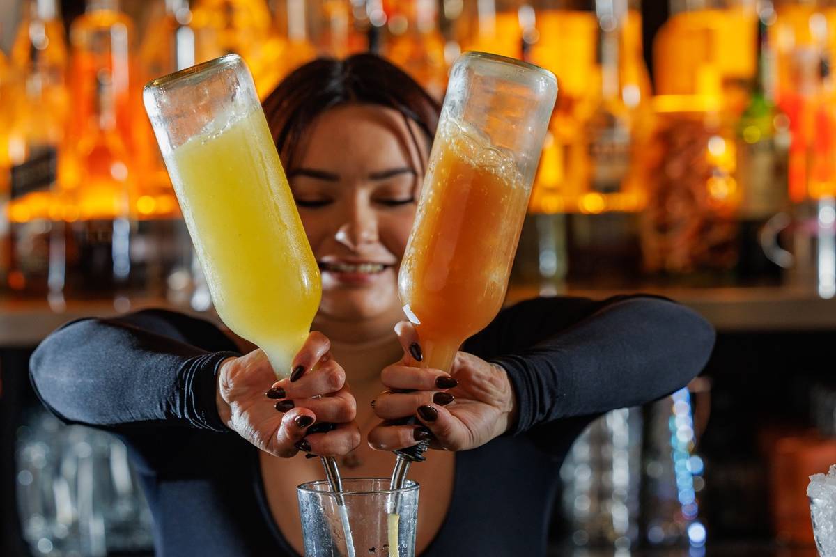 A bartender making drinks