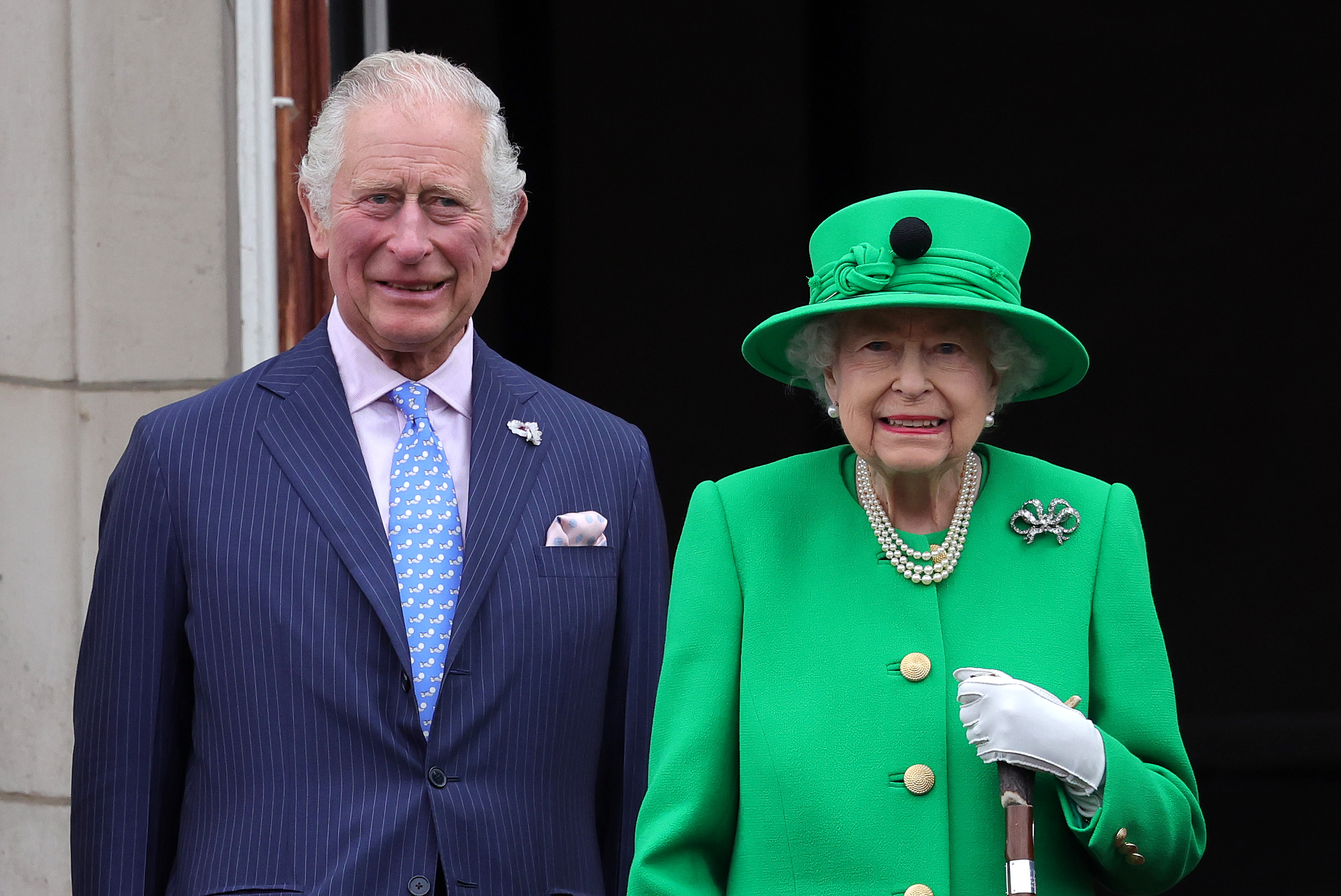 King Charles and Queen Elizabeth standing next to each other and smiling