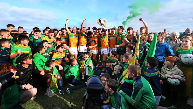 12/10/2025  Dunloys A players celebrate with the Padraig Mc Namee Cup    in the    Championshup Final   at   Corrigan  Park  Picture  Seamus  Loughran