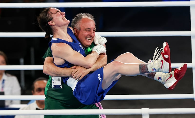 Kellie Harrington celebrates with coach Zaur Antia after winning gold in Paris. Photograph: Ryan Byrne/Inpho