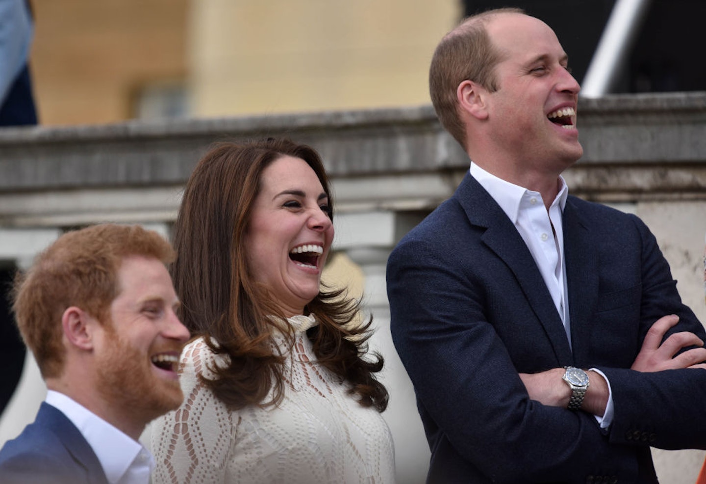 Prince Harry, Catherine, Duchess of Cambridge and Prince William, Duke of Cambridge laugh as they host a tea party in the grounds of Buckingham Palace to honour the children of those who have died serving in the armed forces