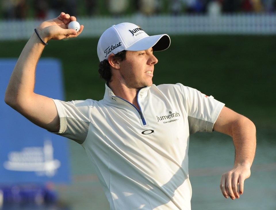 Rory McIlroy of Northern Ireland throws his ball into the crowd as he celebrates his win after finishing at 18 under par on the final day of the Lake Malaren Shanghai Masters golf tournament in Shanghai on October 30, 2011.          AFP PHOTO/Mark RALSTON (Photo credit should read MARK RALSTON/AFP via Getty Images)