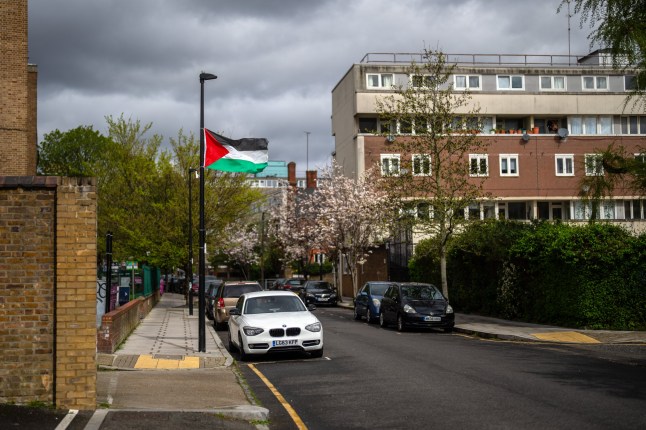 LONDON, ENGLAND - APRIL 4: A Palestinian flag hangs from a lamppost in Tower Hamlets on April 4, 2024 in London, England. Despite Tower Hamlets Mayor Lutfur Rahman saying he had taken the 