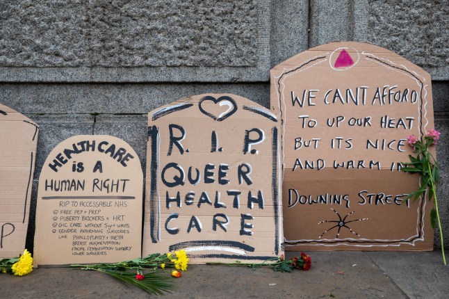 Tombstones brought to Trafalgar Square by activists from AIDS Coalition to Unleash Power (ACT UP) London, a diverse and non-partisan international grassroots political group working to end the AIDS pandemic, for a mass die-in to mark World AIDS Day (WAD) on 1 December 2022 in London, United Kingdom. ACT UP London are calling for collective national action against government policies which are forcing the closure of HIV/AIDS education, prevention and support services. World AIDS Day is an international day dedicated to raising awareness of the AIDS pandemic caused by the spread of HIV infection and mourning those who have died of the disease. (photo by Mark Kerrison/In Pictures via Getty Images)