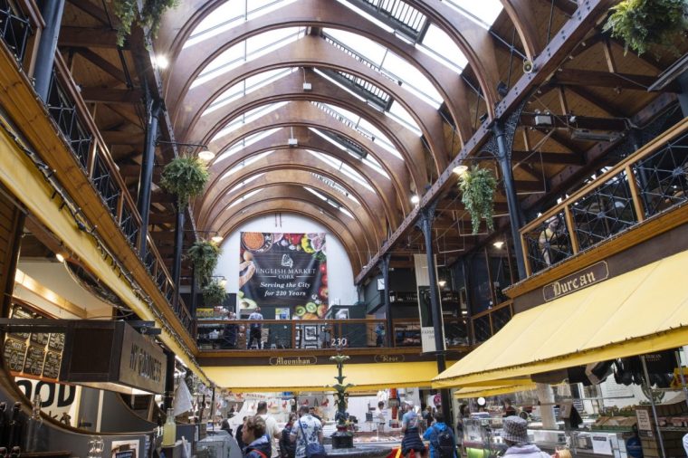 CORK IRELAND - JULY 31ST 2022; Interior of the English Market major municipal food market in the centre of Cork City with shoppers and tourists at the 'Farmgate Cafe' . This 19th Century market stretches from Princes Street to the Grand Parade and is known for its artisan food