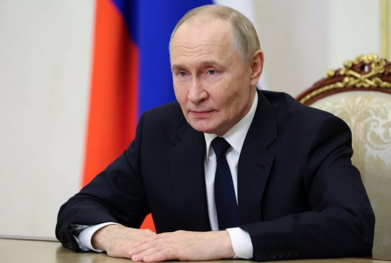Russian President Vladimir Putin makes a video address to participants of the final stage of the 5th International Olympiad on Financial Security, at the Kremlin in Moscow, Russia, Monday, Sept. 29, 2025. (Alexander Kazakov, Sputnik, Kremlin Pool Photo via AP)