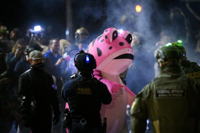 PORTLAND, OREGON - OCTOBER 18: Anti-I.C.E. protesters clash with federal agents at the U.S. Immigration and Customs Enforcement building on October 18, 2025 in Portland, Oregon. Organizers expect millions to participate in cities and towns across the nation for the second