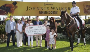 Michael Copeland, CEO of Woodbine, makes a presentation to Vicki Pappas, chairperson and founding member of LongRun, local trainer and volunteer Liz Elder, and Thoroughbred Aftercare Alliance’s Stacie Clark Rogers and Emily Dresden and Emily’s daughters Aria and Lainey. (Michael Burns Photo)