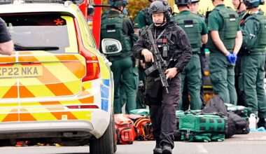 An armed police officer at the scene of a stabbing incident at Heaton Park Hebrew Congregation synagogue, in Crumpsall, Manchester, England, Thursday Oct. 2, 2025. (Peter Byrne/PA via AP)