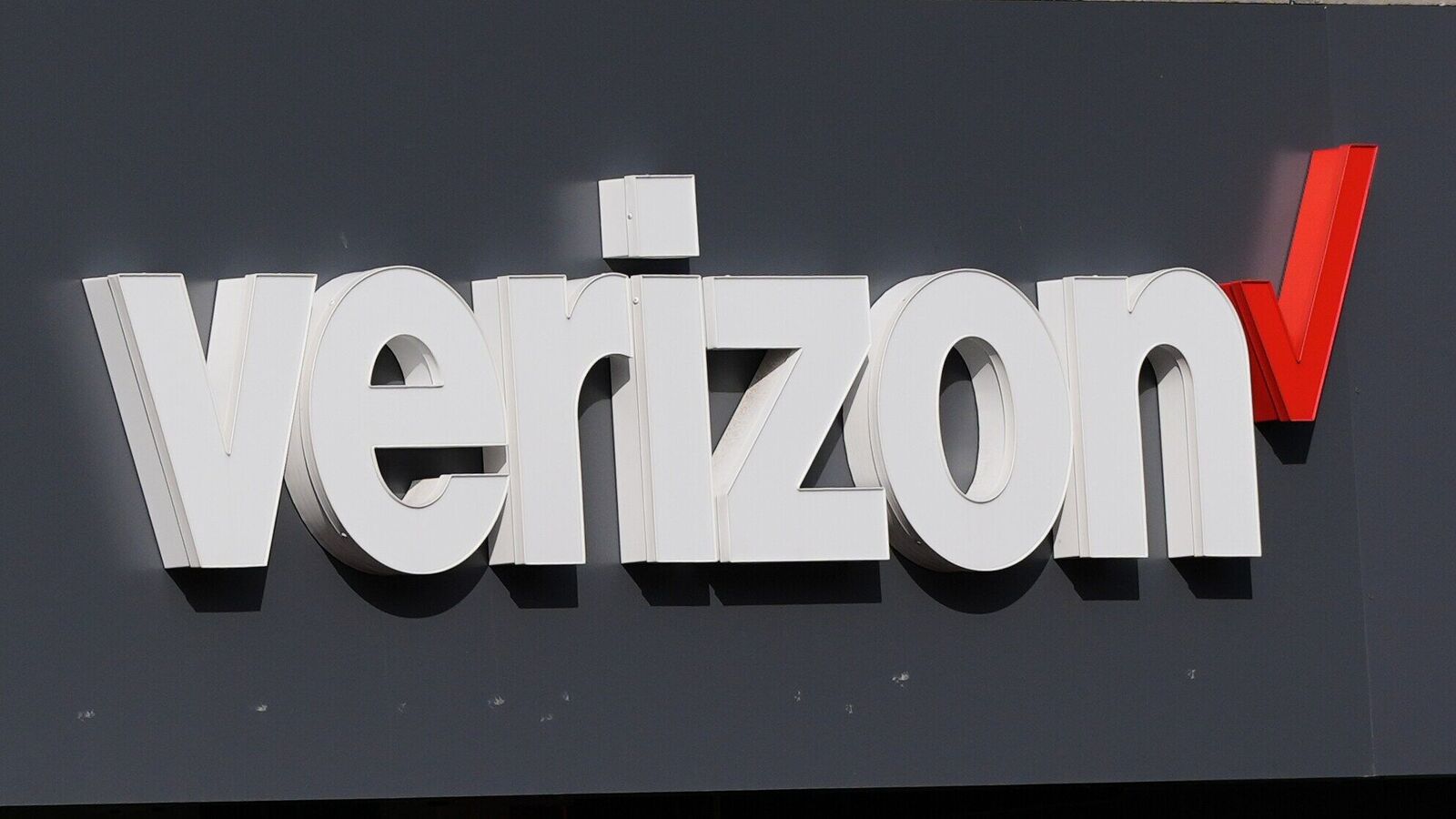 FILE - A Verizon sign is displayed on a store, Sept. 30, 2025, in Cambridge, Mass. (AP Photo/Charles Krupa, file)