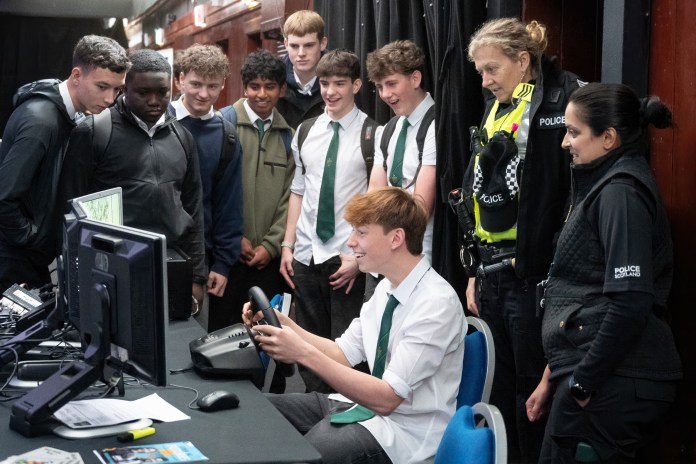 School children have a go on a driving simulator at the event (C) The City of Edinburgh Council