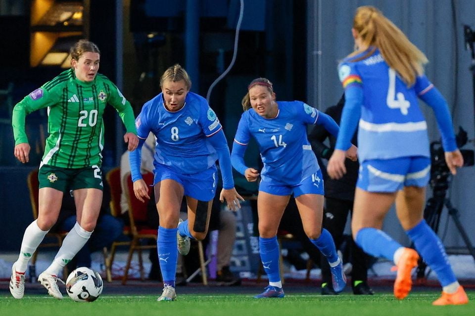 Northern Ireland's Caragh Hamilton tries to get away from three Iceland defenders
