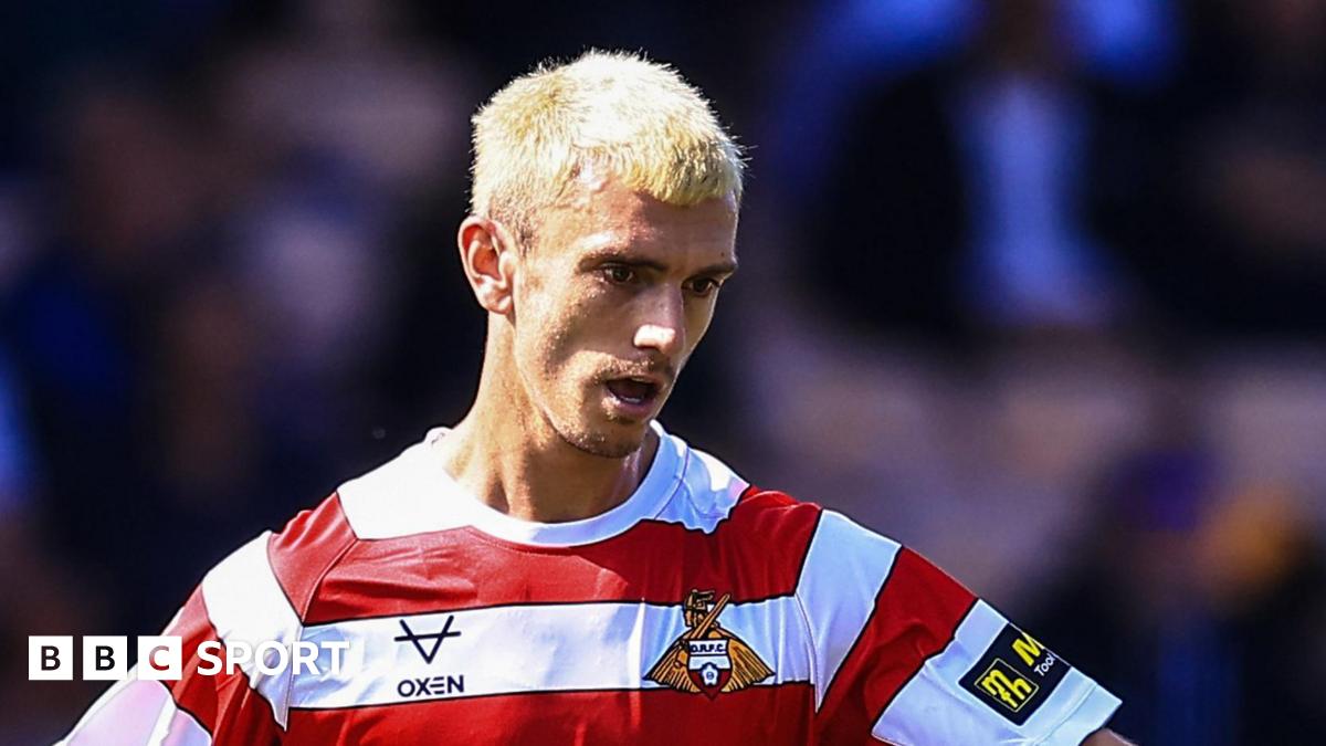 Zain Westbrooke playing for Doncaster last season, with bleach blond hair