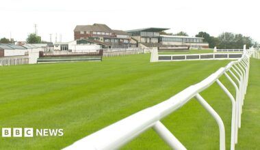 Exeter Racecourse with hurdles, fences and the main stand
